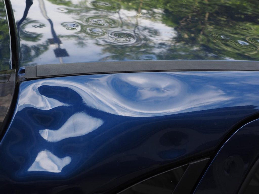 A car with damage which wouldn't happen when we tow vehicles