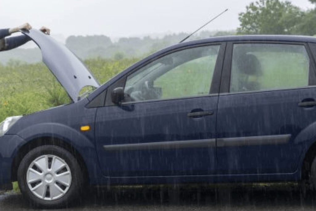 A car in Swansea that has the bonnet up and needs a recovery