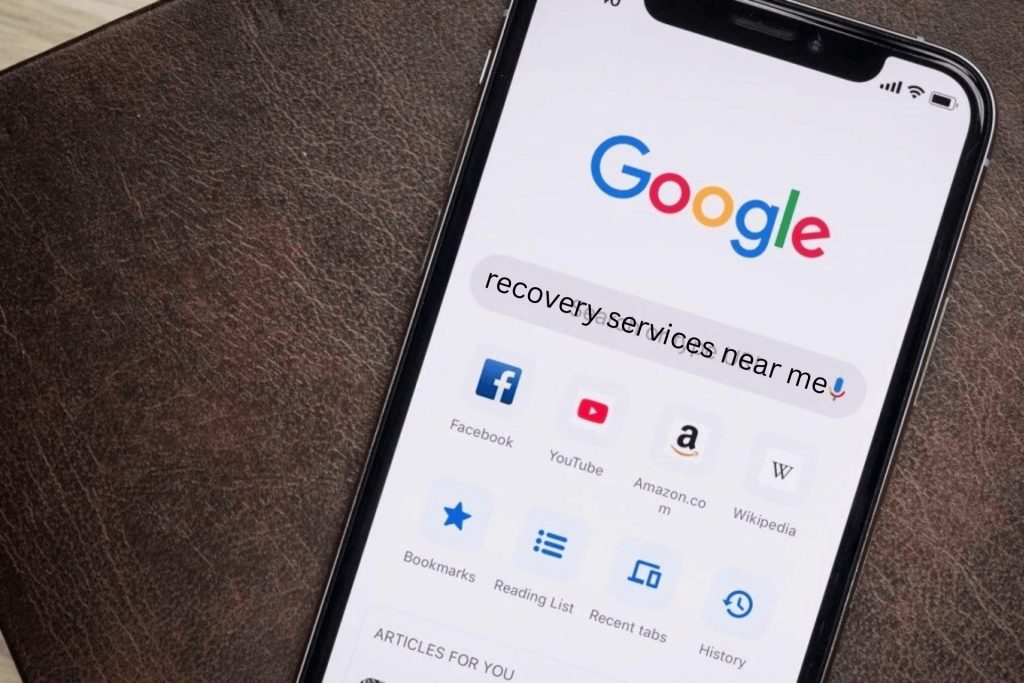 An iPhone where someone has searched recovery services near me on