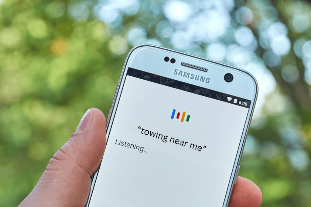 A voice search on a Samsung mobile for towing near me